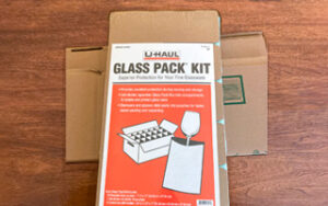 U-Haul Glass Pack Kit with Box features 18-cell divider, foam pouches, and medium box.
